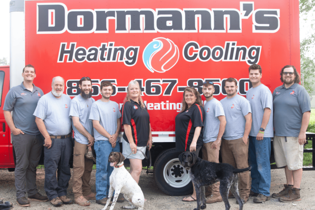 The whole Dormann's Team standing in front of one of their trucks