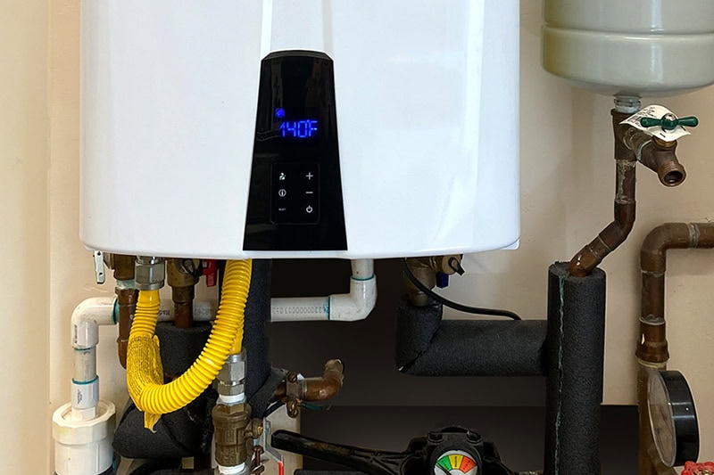 What Is a Tankless Water Heater? The digital screen to a tankless heater.